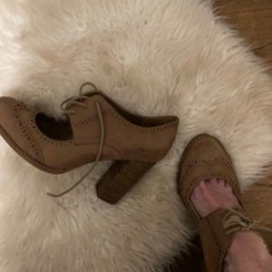 Lace-up Oxford style heels with cutout detail